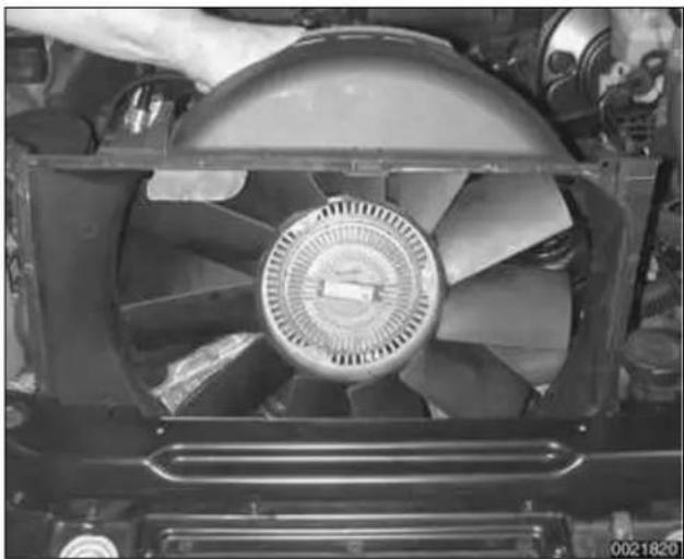 Close-up of a hand holding a large industrial fan component (no visible text or symbols)