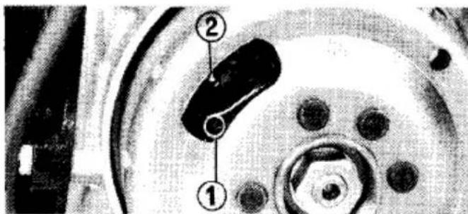Technical diagram of a mechanical component with numbered parts labeled 1 and 2