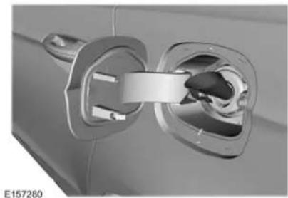 Close-up of a car electrical plug with a metallic connector (no visible text or symbols)