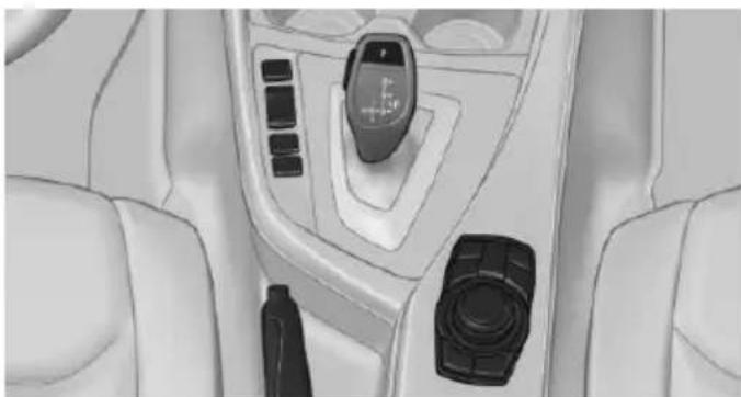 Interior view of a car dashboard with steering wheel and control panel (no text or symbols visible)
