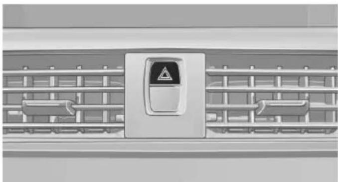 Front view of a car air conditioner unit with ventilation grilles and a warning symbol (no text or labels)