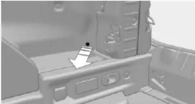 3D rendered mechanical component with a white arrow pointing to a small black dot (no text or symbols visible)