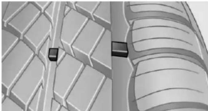 3D rendered diagram of a vehicle's suspension system showing two blocks on a grid-patterned surface (no text or symbols)