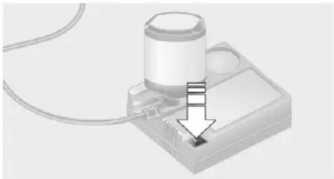3D illustration of a device with a cylindrical component and an arrow pointing to a small electronic component (no text or symbols)