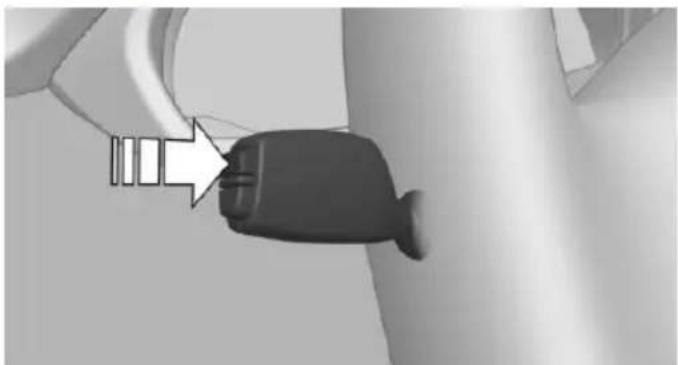 Close-up of a black plastic plug with a white connector, attached to a wall (no text or symbols visible)