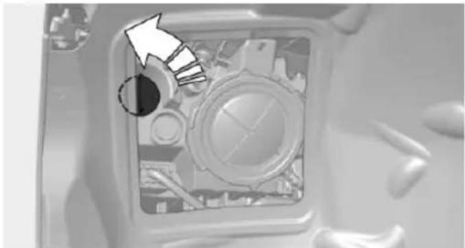 Close-up of a mechanical component with a circular arrow pointing to a specific part (no visible text or symbols)