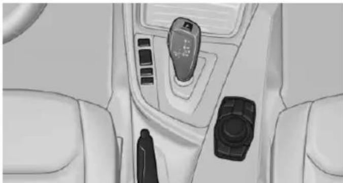Interior view of a car dashboard with control panel and keypad (no visible text or symbols)