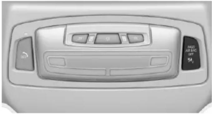 Interior view of a car air bag control panel with buttons and dials (no text or symbols visible)