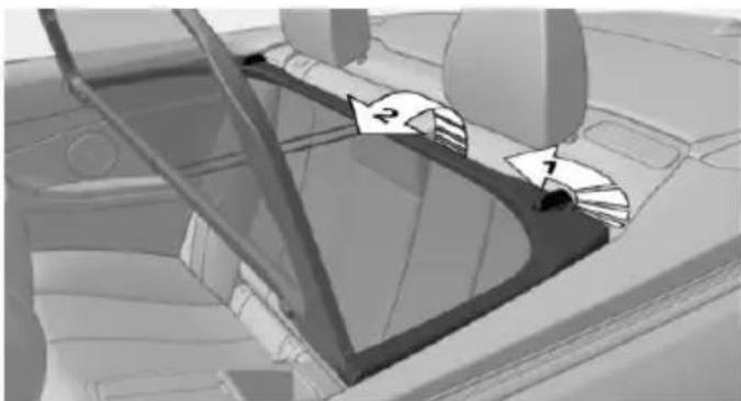 Interior view of a car showing a steering wheel and directional arrows (no text or symbols)