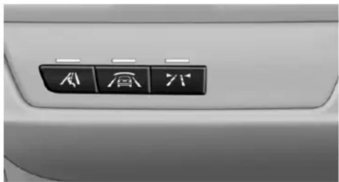 Close-up of a car's front panel showing three directional icons: airplane, train, and bicycle (no text or labels visible)
