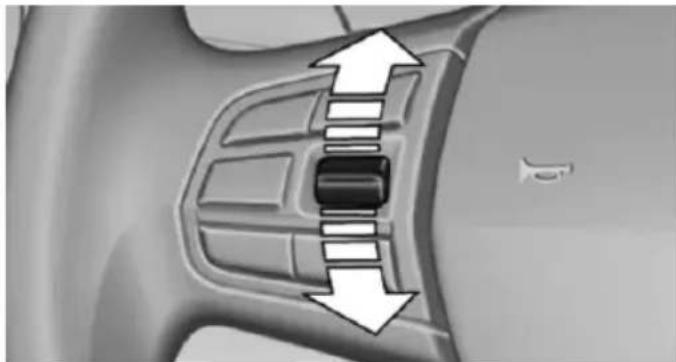 Close-up of a car interior showing a black rectangular component with white arrows pointing to it, indicating movement or force (no text or symbols present)