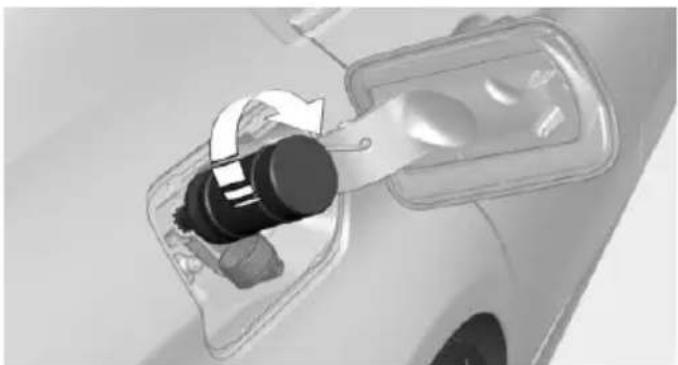 Close-up of a car's electrical plug socket with a rotary switch (no text or symbols visible)