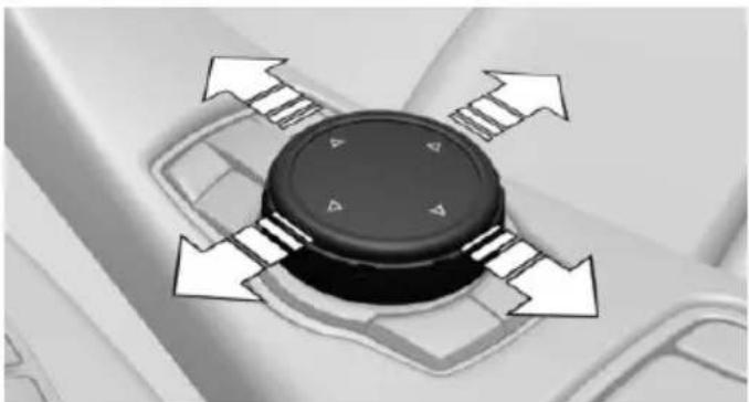 Close-up of a black circular device with four white directional arrows indicating rotation or movement (no text or symbols)