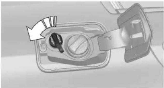 Diagram of a device with a key inserted into a tray, showing internal components and a directional arrow (no text or symbols)