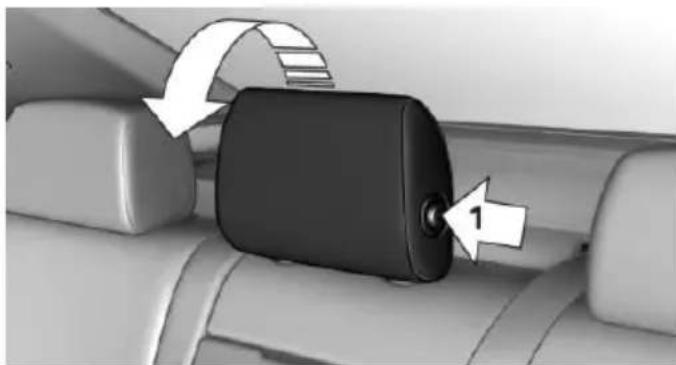 Close-up of a car seatbelt buckle with directional arrows indicating rotation (no text or symbols)
