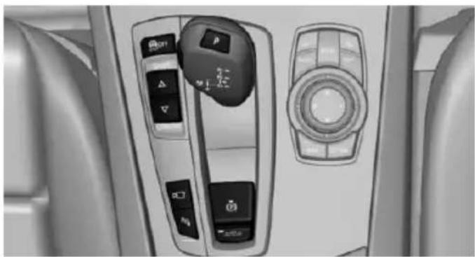 Interior view of a car dashboard with control switches and a rotary knob (no visible text or symbols)