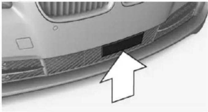 Close-up of a car's side profile with a black rectangular patch and an arrow pointing to it (no text or symbols visible)