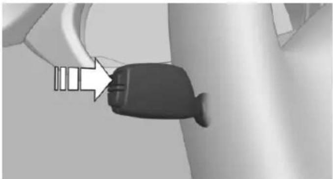 Close-up of a black plastic plug inserted into a wall, with a white arrow pointing to the plug (no text or symbols visible)