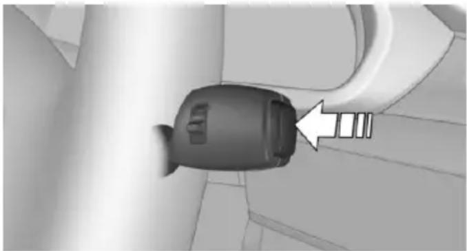 Close-up of a black plastic connector with a white arrow pointing to a small component, no visible text or symbols.