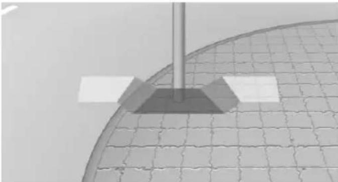 Close-up of a curved metallic structure with grid pattern and a vertical rod, no visible text or symbols