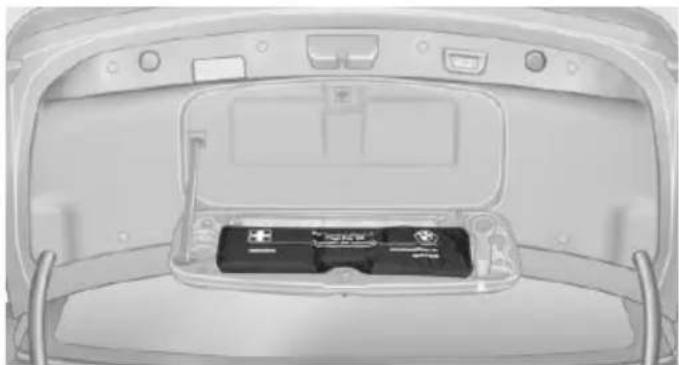 Top-down view of a car rear bumper showing battery pack and ventilation slots (no text or symbols visible)