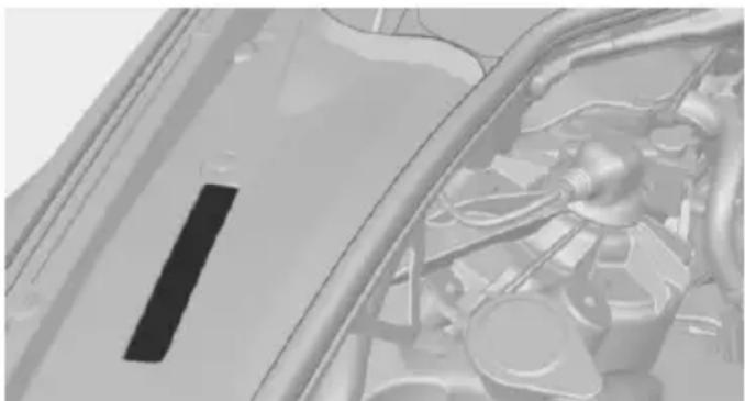 Close-up of a car's engine compartment showing internal components and structural lines (no visible text or symbols)