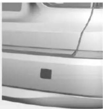 Close-up of a car's side panel showing the front and rear panels with a small square mark on the side (no text or symbols visible)