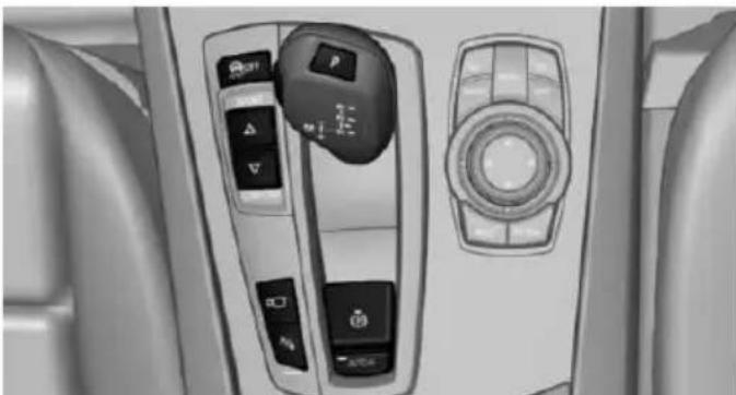 Interior view of a car dashboard with control switches and a rotary knob (no visible text or symbols)