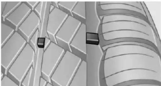 3D rendered diagram of a mechanical component with grid-like surfaces and two black square markers (no text or symbols)