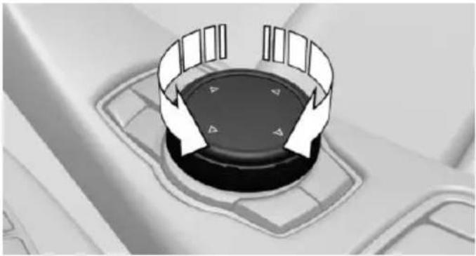 Close-up of a car dashboard with directional arrows indicating rotation or movement (no text or symbols)