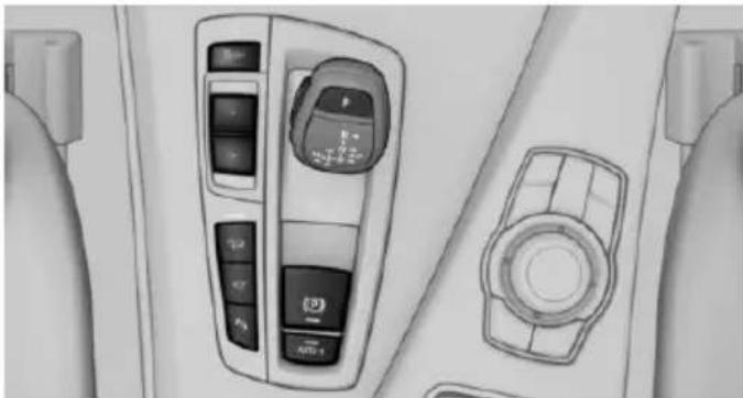 Interior view of a car dashboard with control panels and a circular vent (no visible text or symbols)