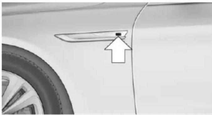 Side view of a car's front bumper with a pointing arrow and label (no text or symbols on the object itself)