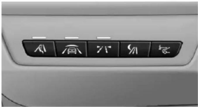 Close-up of a car's front panel with six directional icons (arrow, up, down, down, down, up) on black buttons (no text or symbols beyond icons)