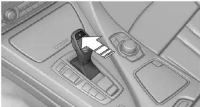 Interior view of a car dashboard with a hand valve and control panel (no visible text or symbols)