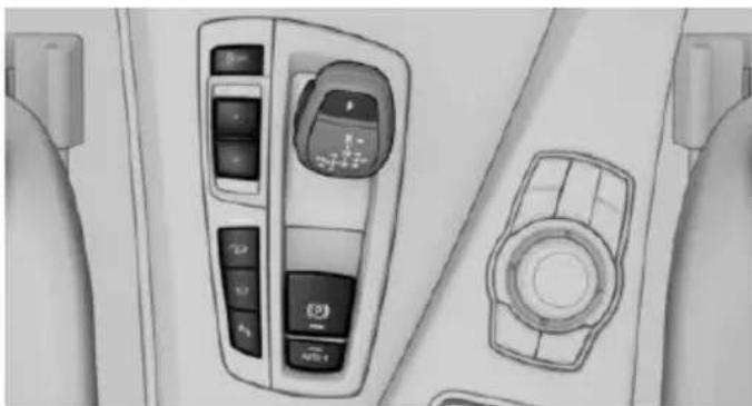 Interior view of a vehicle dashboard with control panels and a circular vent (no visible text or symbols)