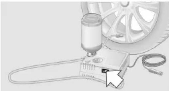 Illustration of a car tire testing setup with a tool and cable (no text or symbols)
