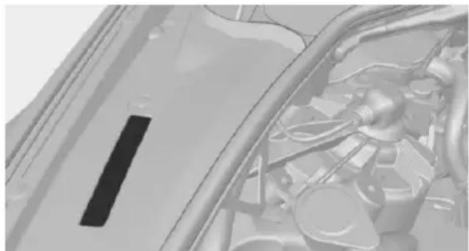 Close-up of a car's engine compartment showing internal components and structural lines (no visible text or symbols)