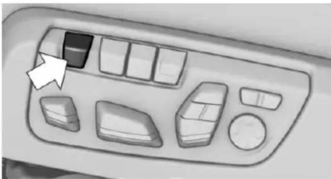 Interior view of a car dashboard with control buttons and a white arrow pointing to a specific panel (no text or symbols visible)