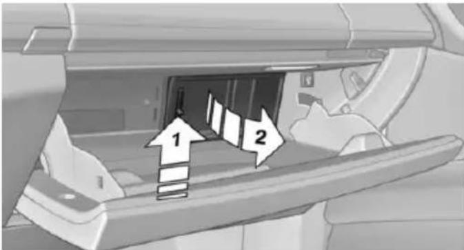 Diagram showing a vehicle interior with labeled directional arrows indicating movement or flow, marked as 1 and 2.