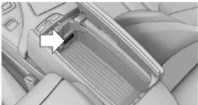Interior view of a car headrest with a white arrow pointing to a component (no visible text or symbols)