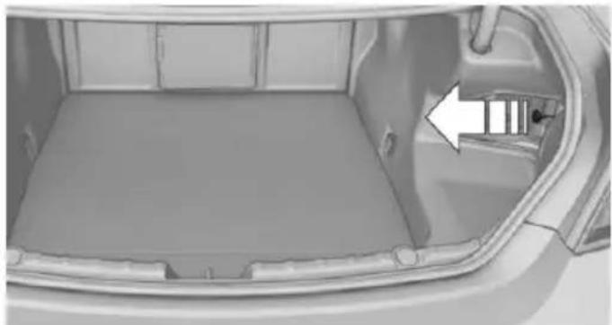 Interior view of a car showing the backrest tray and side door, with an arrow pointing to a component (no text or symbols visible)