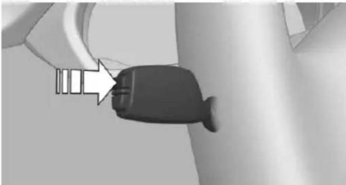 Close-up of a black plastic plug inserted into a wall, with an arrow pointing to it (no text or symbols visible)