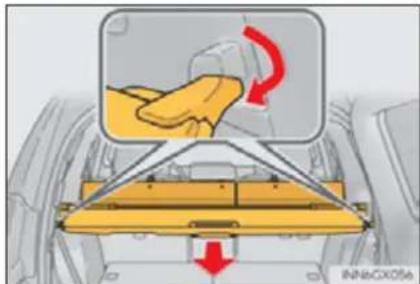 Diagram showing a hand pressing down on a mechanical component with red directional arrows indicating motion or force.