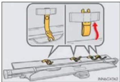 Diagram illustrating a mechanical assembly with labeled parts and directional arrows, likely illustrating a motion or assembly process.