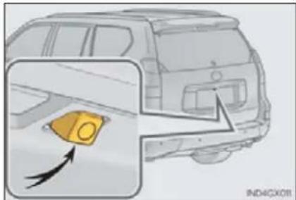 Diagram showing a car interior with a yellow object and directional arrow, labeled 'IND4GX08'