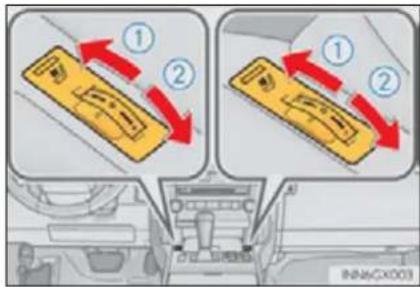 Diagram showing two car interior compartments with directional arrows and labeled parts, likely illustrating vehicle movement or safety instructions.