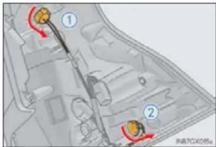 Diagram of a vehicle engine showing two labeled components with red arrows indicating flow or movement paths.