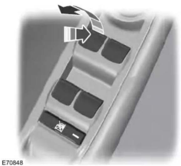 Close-up of a car's front panel with buttons and a cursor arrow (no text or symbols)