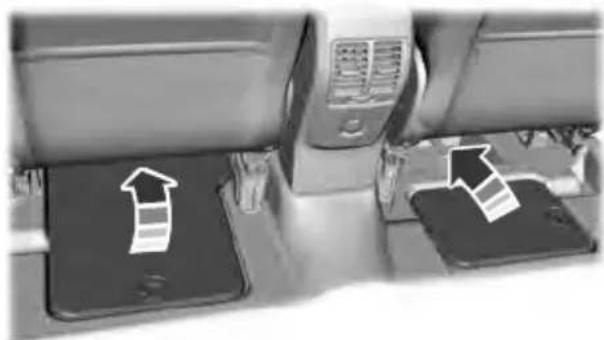 Interior view of a mobile phone setup with two smartphones and a wall-mounted device (no visible text or symbols)
