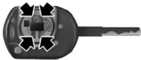 Close-up of a black mechanical component with four directional arrows indicating flow or movement (no text or symbols)